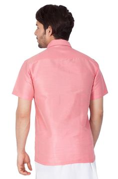 Vastramay brings to you this Stylish yet Comfortable Men Pink Ethnic South Indian Shirt. Adorn it for a perfect Classy and Trendy look. These Shirts are usually very popular in Souther part of the Sub Continent. These are also called Madras Shirt. It is worn along with a trouser or a jeans. However, traditionally it is paired with a mundu or a white dhoti. The set is also called as Shirt Vesty. Product Features :   Top Color: Pink Top Fabric: Cotton Art Silk Product Type: Ethnic South Indian Shi Traditional Cotton Shirt For Eid, Festive Traditional Fitted Shirt, Traditional Festive Short Sleeve Shirt, Traditional Short Sleeve Festive Shirt, Traditional Short Sleeve Summer Kurta, Casual Short Sleeve Kurta For Festive Occasions, Short Sleeve Tops For Eid Festivities, Festive Short Sleeve Tops For Eid, Fitted Traditional Kurta With Short Sleeves