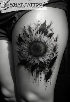 a woman's thigh with a sunflower tattoo on it