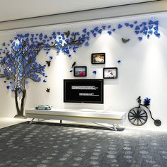 a living room decorated with blue butterflies on the wall and a tree in the center