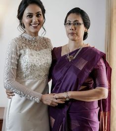 two women are standing next to each other