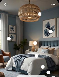 a bed room with a neatly made bed and a chandelier hanging from the ceiling