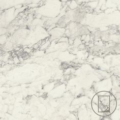 a white marble textured surface with a black circle on the bottom right hand corner