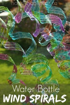 the cover of water bottle wind spirals is shown in front of a grassy area