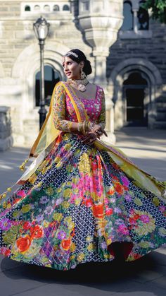 Do you like outfits that are fun, colorful and modern? If yes, then this lehenga is for YOU! Black satin silk lehenga with multi color printed flowers contrasted with a fuchsia pink net blouse with gold hand embroidery! Paired with a yellow net dupatta! Satin Silk Lehenga, Net Blouse, Printed Flowers, Net Blouses, Silk Lehenga, Gold Hand, Net Dupatta, Gold Hands, Satin Silk