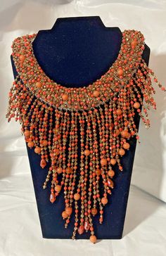 Rara Avis by Iris Apfel 17" Orange Multi Fringe Necklace  NWT Looking for unique and special?Find it in this fashion-flavoring fringe from Rara Avis.  Design Information.  Orange, brown, gray and clear beads form necklace and its graduated, multi-dangle fringe drape. Beads on fringe are rondelles, smooth beads, faceted beads and geometric-shaped. Beads on columns forming necklace are smooth and faceted. Brand: Rara Avis by Iris Apfel Findings: Lobster-claw clasp Drape Measurements: Approx. 8"L x Funky Formal, Funky Necklace, Rara Avis, Necklace Art, Clear Beads, Fringe Necklace, Orange Brown, Fashion Jewelry Necklaces, Faceted Bead