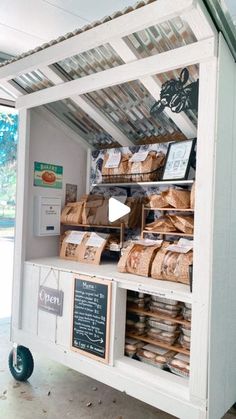 the food cart is full of bread and other items