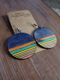 RAINBOW SUNSET Large Wood Earrings Don't you hate when earrings are so heavy they hurt your ears? Look no further, these lightweight wood earrings will not pull on your ears. These wood earrings are made for women to wear everyday. They are made from recycled hard wood and are a large 40MM size dangling wood shown in the picture, but you can pick the size that works for you at check out. The earrings are so fun. They are made of off cuts of carpenter's wood, laser cut and engraved with a sleek h Bohemian Multicolor Wooden Bead Earrings, Multicolor Hand Painted Earrings For Beach, Multicolor Wooden Jewelry As A Gift, Multicolor Wooden Jewelry Gift, Bohemian Wood Dangle Earrings, Rainbow Sunset, Large Dangle Earrings, Earrings Colorful, Hippie Earrings