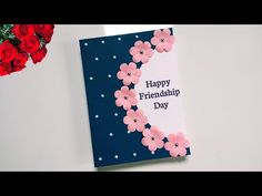 a card that says happy friendish day with flowers on the front and back of it