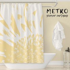 the shower curtain is yellow and white in color