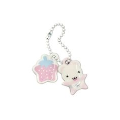 a white and pink keychain with a cartoon character on the front, and a star in the back