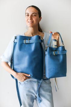 Gorgeous Blue leather bag for women, which is ideal for travel and makes a perfect Leather crossbody / Backpack purse. Handmade from the softest leather to last a lifetime. True combination of style and comfort. 🌟Convertible leather bag: You can customize your purse to be Convertible and serve as three Bags in one - a Backpack, Crossbody bag and a Shoulder Bag. * Simple, Elegant * High Quality, Soft natural leather . * Safe - Front buckle and button snap closing mechanism. * Interior pocket wit Blue Leather Backpack For Everyday Use, Travel Bucket Bag With Leather Strap, Leather Hobo Bag Standard Backpack For Travel, Leather Strap Bucket Bag Tote For Travel, Soft Leather Bucket Backpack, Blue Leather Backpack With Removable Pouch For Daily Use, Daily Use Leather Crossbody Backpack, Rectangular Leather Strap Bucket Bag For Travel, Blue Leather Travel Backpack