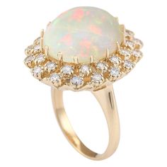 Stamped: 14K Yellow Gold Total Ring Weight: 11.5 Grams Ring Length: N/ARing Width: N/A Gemstone Weight: Total Natural Opal Weight is 10.19 Carat (Measures: 16.60x14.55 mm) Color: Multicolor Diamond Weight: Total Natural Diamond Weight is 1.10 Carat Quantity: 32 Color: F-G, Clarity: VS2-SI1 Face Measures: 24.40x21.45 mm Sku: [703466W] Formal Multi-stone Opal Ring With Diamonds, Formal Multi-stone Diamond Opal Ring, Luxury Oval Opal Ring With 17 Jewels, Luxury Opal Ring With 17 Jewels For Anniversary, Exquisite Multi-stone Opal Ring For Formal Occasions, Formal 14k Gold Opal Ring, Luxury Multi-stone Opal Ring In 14k Gold, Luxury Yellow Gold Opal Ring With Halo Setting, Formal Fine Jewelry Opal Ring With Round Cut