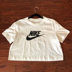 Nike ‘The Nike Tee’ Cropped Tee New With Tags Condition Brand-New, Never Worn White Cropped Tee With Black Nike Logo Screen-Printed On Front White Cropped T-shirt With Logo Print For Spring, Spring White Cropped T-shirt With Logo, Casual White Cropped T-shirt With Logo Print, Casual White Cropped T-shirt With Letter Print, Nike Basic Graphic Print Top, Nike Basic Top With Graphic Print, Nike Casual Logo Print Tops, Trendy Nike Top With Letter Print, Nike Casual Tops With Logo Print