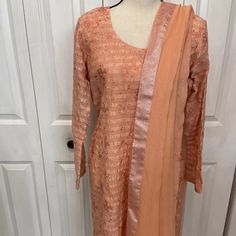 Pakistani Indian Three Piece Beautiful Formal Suit.Brand Bareeze Color Peach.Brand New.Sz Approximately Bust 21.5”Waist 18”Arm 22.5”Length 38.5”Hip 21.5”Shalwar 38” Elegant Peach Kurta With Dupatta, Elegant Peach Kurta For Festive Occasion, Elegant Peach Sets For Eid, Elegant Unstitched Peach Set, Elegant Peach Unstitched Set, Elegant Orange Salwar Kameez With Dupatta, Fitted Kurta With Sheer Dupatta For Spring, Spring Fitted Kurta With Sheer Dupatta, Fitted Sets With Sheer Dupatta For Spring