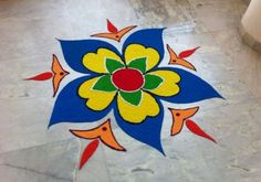 a colorful flower design on the ground