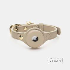 the vegan leather dog collar is shown in beige