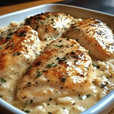 chicken and grits with gravy in a casserole dish