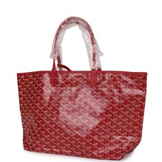 This St. Louis PM tote is in Red Goyardine canvas with silver tone hardware and features red leather handles and trim, removable pouch and white stitching.The interior is lined with white canvas.Origin: FranceCondition: New and never wornAccompanied by: Goyard dustbag, felt, carebook, and removable pouchMeasurements: 13.3" x 11" x 6"; 7" shoulder strap Jewelry Gift Guide, Neverfull Mm Monogram, Hermes Bags, Leather Handles, Chain Shoulder Bag, Monogram Logo, White Canvas, Luxury Handbags, Leather Handle