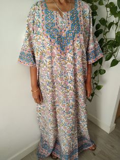 This Item is handmade.  The fabric used is top quality cotton to ensure your skin is pampered and always natural. It is beautifully painted on with blocks- a traditional Indian style of printing.Each layered block by block,colour by colour, creating an exquisite design. The design is multi functional depending on your mood, Use it like a kaftan to lounge around the house in or even as a swim cover up for your day at the beach or pool. The second item and consecutive items of the same order are U Bohemian Loose Floral Print Dress, Bohemian Loose Dresses With Floral Print, Loose Bohemian Dress With Floral Print, Loose Bohemian Floral Print Dress, Loose Bohemian Beach Cover-up Dress, Loose Floral Print Beach Dress, Bohemian Printed Short Sleeve Cover-up, White Printed Bohemian Beach Dress, White Boho Print Kaftan For Vacation