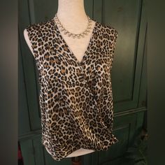 New With Tags Joie Sleeveless Leopard Print Faux Wrap Top Drapes At The Waist And Has A Bit Longer Back For A Front Tuck Type Look. Size Medium. Fabric Has A Great Feel 97% Polyester 3% Spandex. Approx 20” Pit To Pit. (Pictured With Anne Klein Necklace Also Available In My Closet) Chic Brown Tank Vest, Chic Leopard Print Cami Top, Elegant Sleeveless Leopard Print Tops, Chic Brown Vest Top, Chic Leopard Print Sleeveless Top, Sleeveless Brown Tops For Night Out, Brown Sleeveless Top For Night Out, Sleeveless Leopard Print Top For Night Out, Faux Wrap Top