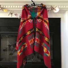 Amazing Never Worn Poncho. Red One-size Poncho Cape, Red One-size Cape Poncho, Red One-size Cape Shawl, Red One Size Cape Poncho, Red Poncho For Festival In Fall, Bohemian Red Shawl Cape, Red Fall Festival Poncho, Red Bohemian Shawl Cape, Red Cape Poncho For Festival