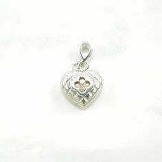 "This pendant weighs 4.8 Grams Its dimensions are  3/4\" inches tall (not including bale) x 5/8\" inches wide The Loop/Bail will fit a chain up to A: 3 B: 3.7 mm wide The pendant features Heart Clover Stone/Design Markings: Heidi Klum, 925, Thailand, (Tested and guaranteed to be Sterling Silver) Condition: Estate, Great, light patina NOTE: Variations in color in the pictures are due to reflections. The color in person is a beautiful even silver. Thank you for viewing my item!  Please favorite my store to be updated on sales." Nickel Free Silver Heart Charms, Sterling Silver Heart Pendant Necklace With Charms, Silver Heart Charms For Jewelry Making, Sterling Silver Jewelry For Valentine's Day, Heart Pendant Charms For Gifts, Sterling Silver Heart Charms For Jewelry Making, Metal Heart Pendant Necklace With Charms, Small Heart Charm Jewelry For Valentine's Day, Elegant Nickel Free Heart Charms