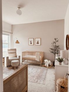 a baby's room with a crib, rocking chair, and dresser in it