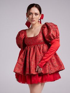 Red brocade dress with large sleeves, narrow cuffs and open neckline. The puffy skirt consists of three layers. The back closure imitates corset lacing and is tied with a bow. Limited edition Red brocade embroidered with a floral pattern Fabric: 70% viscose, 30% polyester The model is wearing size S Made in Czech Republic Red Brocade Set With Intricate Embroidery, Red Fitted Brocade Dress, Semi-stitched Red Brocade Sets, Embroidered Red Brocade Set, Vintage Brocade Victorian Dress, Megan Dress, Puffy Skirt, Corset Lace, Brocade Dresses