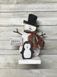 a snowman with a top hat and scarf