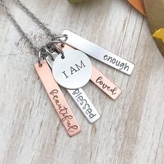 A gorgeous mixed metal necklace featuring four bars alternating between copper and silver charms along with a round charm too.The words will be stamped as shown. “I am” on the 3/4” charm. “Blessed” “beautiful” “loved” “enough” on the alternating copper and aluminum bars. The bars measure 1/4” x 1 1/2” and are made of copper and aluminum. The round charm measures 3/4” and is made of aluminum. After stamping, all five charms are hung on an 18” stainless steel chain. Each word has been carefully ha Engraved Metal Jewelry, Metal Stamping Necklace, Stamped Metal Ideas, Jewelry Stamping Ideas, Stamped Necklace Ideas, Hand Stamped Jewelry Ideas, Stamped Jewelry Ideas, Engraving Ideas Jewelry, Metal Stamping Ideas