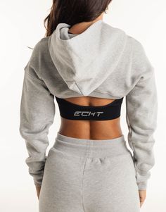 Meet the High Cut Hoodie, the perfect layering piece that deserves to be a part of the all-year rotation. The ultra cropped length is the High Cut Hoodie's best attribute, great for showing off your sportsbra and/or bikini. Add in a hoodie and you've got a top that can provide style and warmth - Super soft cotton/polyester blend - In-trend ultra cropped silhouette - Large hood - Designed to flatter every size - Worn by our inhouse team for the perfect fit 62% Cotton, 38% Polyester Bella is wearing a Small She is 170cm (5'6") tall with an 33" bust, a 25" waist and 36" hip Black Sporty Cropped Hoodie, Cropped Athleisure Activewear For Streetwear, Fitted Cropped Athleisure Hoodie, Sporty Stretch Crop Top For Streetwear, Gray Sporty Crop Top For Gym, Sporty Cropped Crop Top For Streetwear, Sporty Gray Crop Top For Gym, Sporty Gray Cropped Top, Sporty Cropped Sweatshirt For Winter