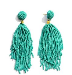 These turquoise dangle seed bead earrings add the perfect pop of color to any outfit and are amazingly lightweight. Product Details: Metal Color: GoldMaterial: Metal, seed beadsDetails: Tassel, post back, 3" longColor: Turquoise/BlueType: DropStyle: BohoShips: 5-7 days via USPS shipping Turquoise Tassel Earrings With Colorful Beads For Beach, Summer Turquoise Beaded Tassel Earrings, Turquoise Beaded Tassel Earrings For Summer, Turquoise Beaded Fringe Tassel Earrings For Summer, Turquoise Beaded Fringe Earrings For Summer, Summer Turquoise Dangle Beaded Earrings, Pop Of Color, Seed Bead Earrings, Bead Earrings