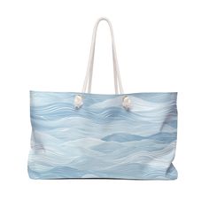 Our oversized Weekender Tote is perfect for your weekend at the beach or in town. The wide-mouthed, durable bag holds a generous amount of personal items and is easily held by its thick rope handles. * This beautiful weekender bag comes in one size - 24" x 13" (60.9 cm x 33 cm) * Perfect for those who love to travel light. Its t-bottom construction and black handles give it a sleek, classic look. * Travel with style with a coastal vibe * Made of high quality materials for great durability Specific details about this product: * 100% Spun Polyester * One size: 24" x 13" (60.9 cm x 33 cm) * Black interior lining * T-bottom construction * All-over print * Assembled in the USA from globally sourced parts * NB! Size tolerance 0.75" (1.9 cm) Summer Large Capacity Light Blue Bag, Rectangular Blue Beach Bag For Summer, Summer Beach Tote Weekender Bag, Beachy Rectangular Beach Bag For Travel, Summer Vacation Tote Travel Bag, Summer Vacation Travel Bag Tote, Blue Large Capacity Shoulder Bag For Vacation, Summer Vacation Weekender Bag, Summer Vacation Travel Tote