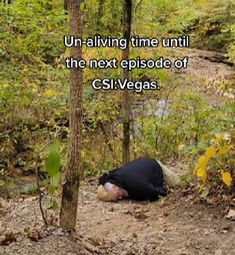 a person laying on the ground next to a tree in the woods with a caption that reads, un - navigating time until the next episode of cslivegas