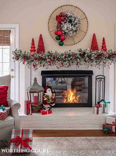 a fireplace decorated with christmas decorations and presents