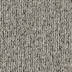 an up close shot of the texture of a carpet with small balls in grey and white