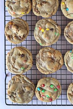 chocolate chip cookies with sprinkles are on a cooling rack, ready to be eaten