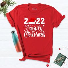 2022 Family Shirt , Family Christmas 2022 Shirt, Christmas Shirt ,Matching Christmas Santa Shirt, New Year Christmas Shirt, 2022 Xmas Shirt. Hi! Welcome to our store. It's good to see you here. Our aim is to offer you first-class clothing in your most beautiful moments with our graphic t-shirts that we designed or designed with your ideas. I am sure you will like our designs for your family, friends and you. IMPORTANT MATTERS FOR ORDERING: 1-) Please check and review all photos. 2-) Our sizes ar Red Short Sleeve T-shirt For New Year, New Year Red T-shirt With Graphic Print, Red Graphic Print T-shirt For New Year, Crew Neck T-shirt For New Year's Holiday, New Year Holiday Crew Neck T-shirt, Crew Neck T-shirt For New Year Holiday, New Year Crew Neck T-shirt With Letter Print, Red Letter Print T-shirt For New Year, Red Festive T-shirt With Letter Print