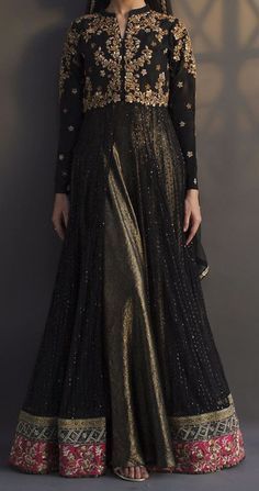 Admirable black peshwas is a multi layered ensemble with sequin stitched net and two tone shimmer fabric. The bodice and sleeves are heavily embellished with florals comprising of resham, zardozi, cut dana, sequin and chain stitches. Colorful resham and zari border on the hem gives the sparkle yet being subtle. Color: Black Fabric: Net Work Details: Embroidered Desi Dress Ideas, Lengha Design Pakistani, Pakistani Dress Design Party Wear, Presentation Dress Outfits, New Dresses Designs Pakistani, Black Traditional Dress Indian, Black Desi Dress, Long Indian Dresses, Black Gown Design