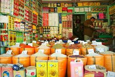 a store filled with lots of different types of food and drink bottles next to each other