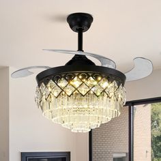 a chandelier hanging from the ceiling in a living room