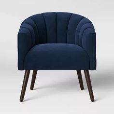 a dark blue chair with wooden legs