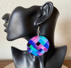 Make a bold, fabulous statement with these colorful lightweight geometric inspired earrings! This one-of-a-kind jewelry works with a wide range of outfits. The earrings were created with 100% cotton fabric and wood.  Fabric is on both side of earrings. Circle measures 2.25" x 2.25". All of our pieces are handmade in our design studio with careful attention to detail and durability.  Additional options available in our shop's Earrings  section. Every set arrives gift wrapped in our signature box.  Orders ship within 1-3 business days.  Domestic US orders include free shipping & tracking.  If you like what you see, please favorite our shop and share with your friends! Please message us below with any questions at Anzhlay Designs. https://www.etsy.com/shop/anzhlaydesigns Modern Adjustable Multicolor Earrings, Bold Geometric Jewelry For Gifts, Modern Multicolor Earrings With Bold Design, Unique Multicolor Geometric Jewelry, Modern Multicolor Geometric Jewelry, Handmade Blue Geometric Earrings, Bold Geometric Earrings, Bold Geometric Earrings With Bold Design, Bold Geometric Designed Earrings