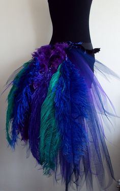 a mannequin with colorful feathers on it