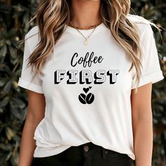 COFFEE FIRST T-SHIRT If you prefer an oversized look, we recommend sizing up. Features: Side-seamed. Shoulder taping. Classic fit. Unisex sizing. Materials: 52% Airlume combed and ring-spun cotton, 48% polyester, 32 singles, 4.2 oz.  LOGO &DESIGN * Actual colors may vary slightly from pictures.  * You can choose your text color from the list in the listing photos. Simply slide the screen to view the choices. * Please do not hesitate to message us if you have questions or concerns. * Please choos Coffee Crew Neck Top With Slogan, Coffee Colored Crew Neck Top With Slogan, Trendy Coffee Crew Neck Tops, Coffee Colored Tops With Letter Print For Fall, Coffee Letter Print Tops For Fall, Casual Coffee Colored Everyday Tops, Casual Coffee Colored Top For Everyday, Casual Coffee-colored Tops With Letter Print, Casual Coffee-colored Letter Print Tops