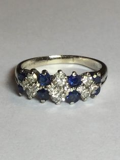 Gorgeous genuine sapphire and diamond band. It is 14k white gold. Total diamond weight is approx. 1/2cttw. There are 4-.05, 2-.10 and 6-.02 diamonds. There are 4-2.8mm and 4-1.8mm sapphires. Diamonds are SI quality and very sparkly. The sapphires do have some wear on them from age that can be seen with a jewelers loop. This ring would be great by itself, as a wedding band or a stackable. It weighs 3.4 grams. It is a size 6.5 and could be sized for an additional fee if needed. Any questions, plea Sapphire Band Ring, Sapphire And Diamond Band, Marriage Ring, Sapphire Band, Stackable Ring, Ring Wedding, Stackable Rings, Diamond Bands, White Gold Diamonds