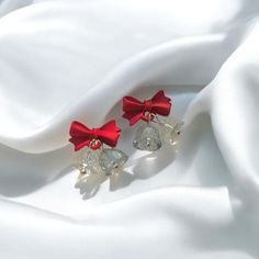 Celebrate the season with these charming New Year Bow Crystal Earrings, perfect for adding a festive touch to your winter wardrobe. Designed with sparkling crystals and Christmas red bell accents, these earrings embody the joyful spirit of the holiday season. The delicate bow detail adds a whimsical charm, making them ideal for Christmas parties, New Year celebrations, or as thoughtful gifts for loved ones. Lightweight and comfortable for daily wear, these earrings will become a go-to accessory Bell Earrings, Winter Jewelry, Earrings Christmas, Charm Making, Crystal Design, Christmas Parties, Wedding Jewelry Earrings, Holiday Jewelry, New Year Celebration