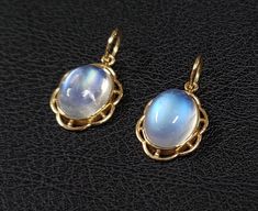 1. Rainbow Moonstone 14k Gold Pendant 2. Made to Order 3. Gemstone - Rainbow Moonstone 4. Jewelry Type - Pendant 5. Total Weight - 1.325 Grams Approx. 6. Moonstone Weight - 3.32 Carats Approx. 7. Gold Weight - 0.661 Grams Approx. 8. Moonstone Size - 8x10 MM 9. Gold Purity - 14k 10. Pendant Bails Size - 6 mm 11. Inclusion based 12. Ready to dispatch in 3 - 5 days. 13. Handmade Items 14. AA Quality Pendant 15. 2 Quantity Available  16. Women Gold Pendant   Pictures are taken under natural and day Oval Moonstone Yellow Gold Jewelry, Handmade Oval Gold Gemstones, Yellow Gold Moonstone Jewelry With Oval Shape, Oval Cabochon Moonstone Jewelry, Celestial Hallmarked Jewelry With Oval Stones, Celestial Style Hallmarked Oval Jewelry, Oval Moonstone Natural Stones, Oval Natural Moonstone Gemstones, Gold Oval Moonstone Ring With Gemstone Accents