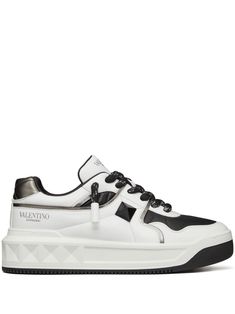 white/black calf leather signature Rockstud embellishment logo-print tongue panelled design front lace-up fastening round toe chunky sole branded insole Valentino Garavani Sneakers, Valentino Sneakers, Stylish Logo, Round Toe Sneakers, Men Formal, Valentino Shoes, Sneakers Women, Star Sneakers, Leather Cap