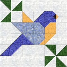 a blue and yellow quilt block with an arrow on the center, surrounded by green grass